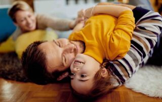 Family enjoying time together at home after understanding aba therapy cost Maryland and support options