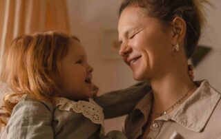 Parent and child sharing a supportive moment while exploring affordable autism therapy Maryland options