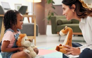 BCBA therapist engaging child in play-based aba therapy session in Maryland home setting