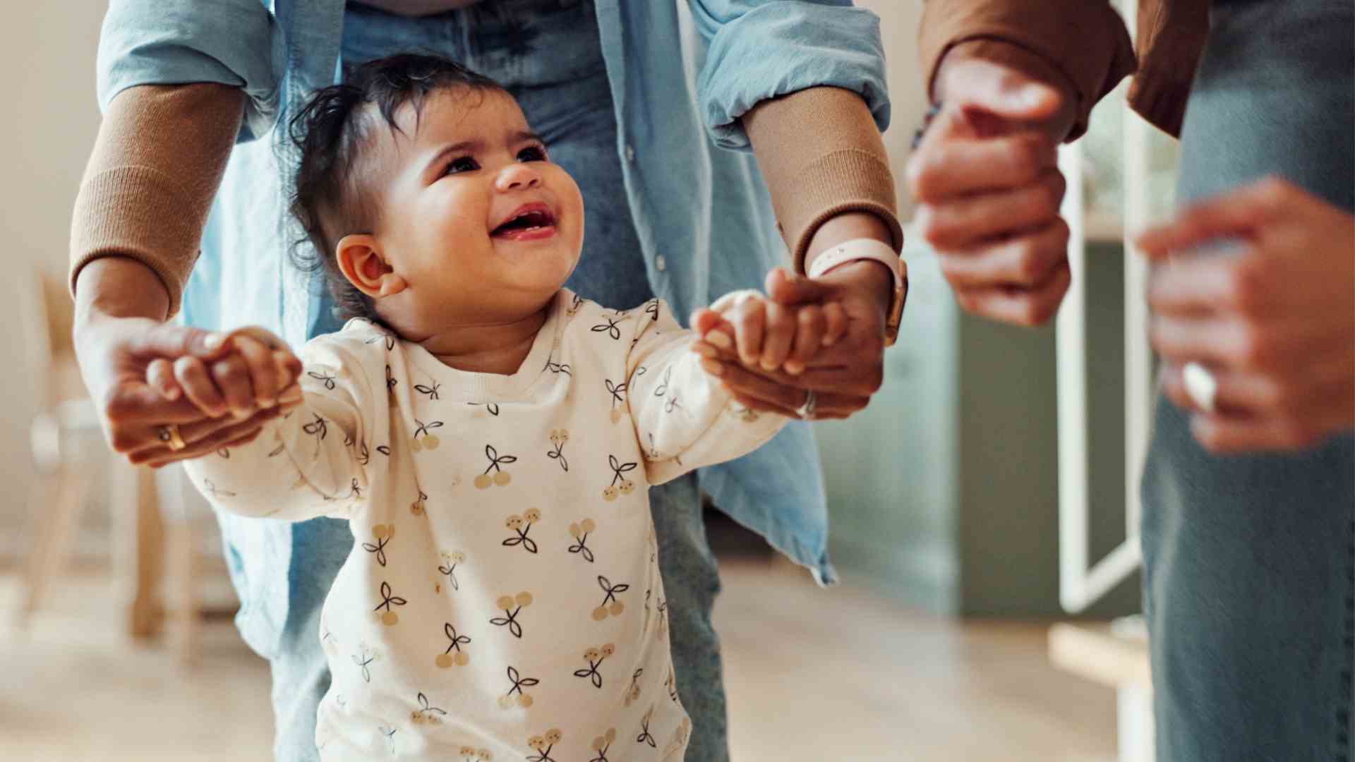 Toddler taking first steps with caregiver during early intervention services Maryland session at home