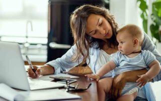 Parent reviewing insurance coverage for ABA therapy Maryland while caring for child at home