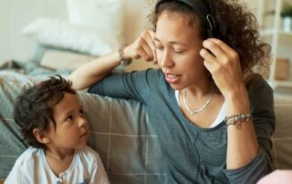 Parent modeling listening skills with child at home, demonstrating positive behavior support strategies for autism in a calm and supportive environment