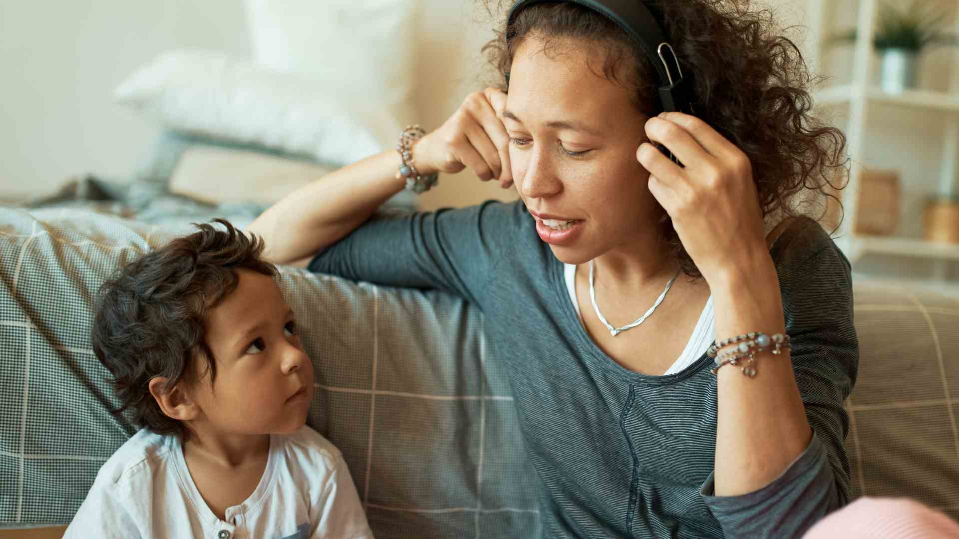 Parent modeling listening skills with child at home, demonstrating positive behavior support strategies for autism in a calm and supportive environment