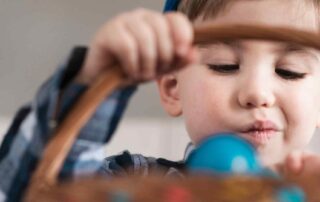 Child engaging in sensory play activity to support proprioceptive input for autism, demonstrating focus and fine motor engagement