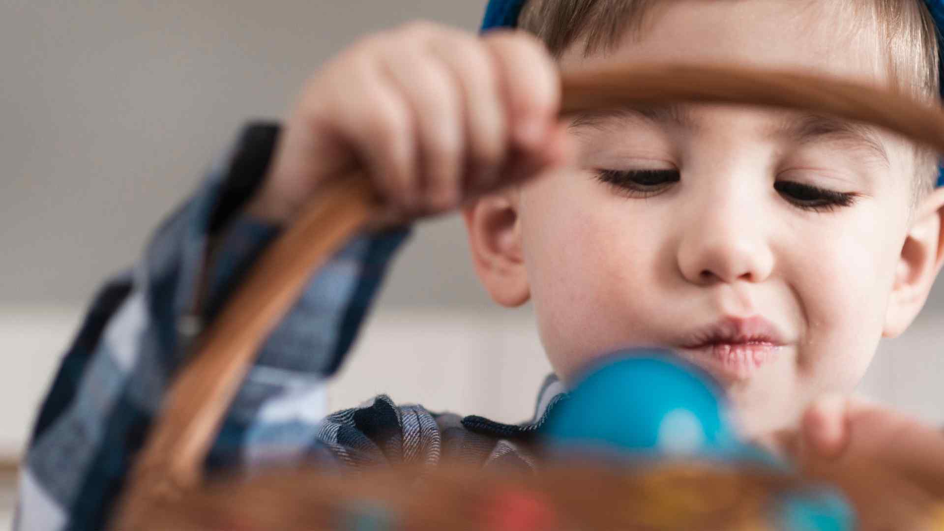 Child engaging in sensory play activity to support proprioceptive input for autism, demonstrating focus and fine motor engagement