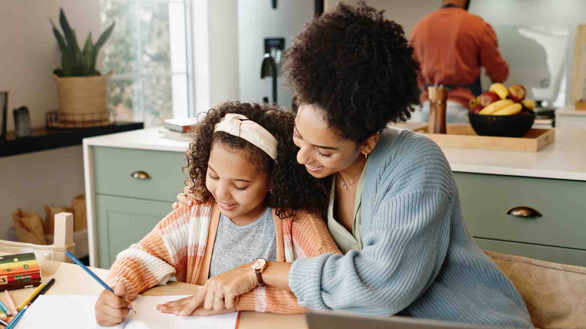 Parent helping child with structured learning activity as part of an autism care plan using ABA therapy at home in Maryland