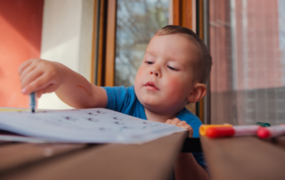 A child with autism practicing an independent morning routine at home with visual support cues, supported by ABA therapy strategies from The Learning Tree ABA in Maryland