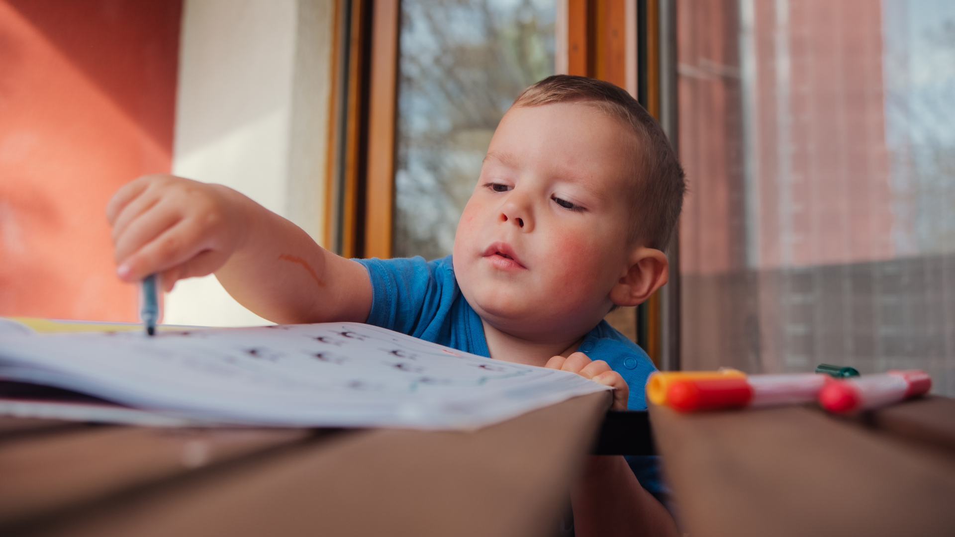 A child with autism practicing an independent morning routine at home with visual support cues, supported by ABA therapy strategies from The Learning Tree ABA in Maryland